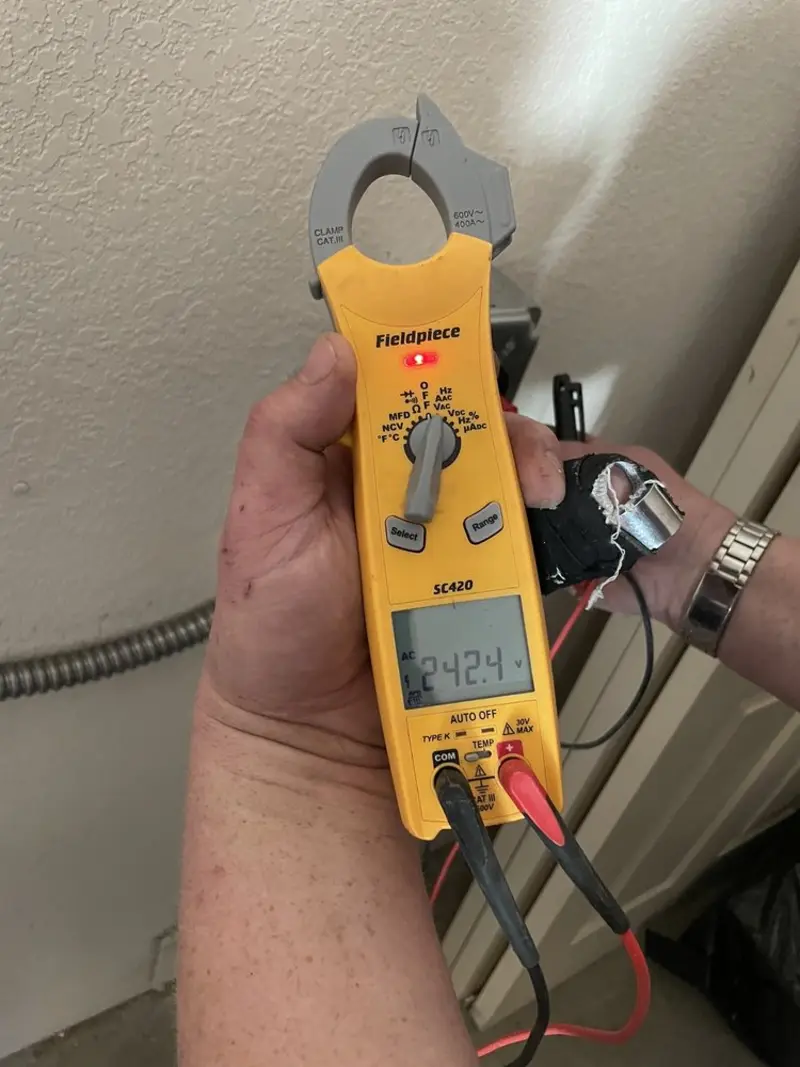 Voltage testing with clamp meter during Ceiling Fan Installation in Medina